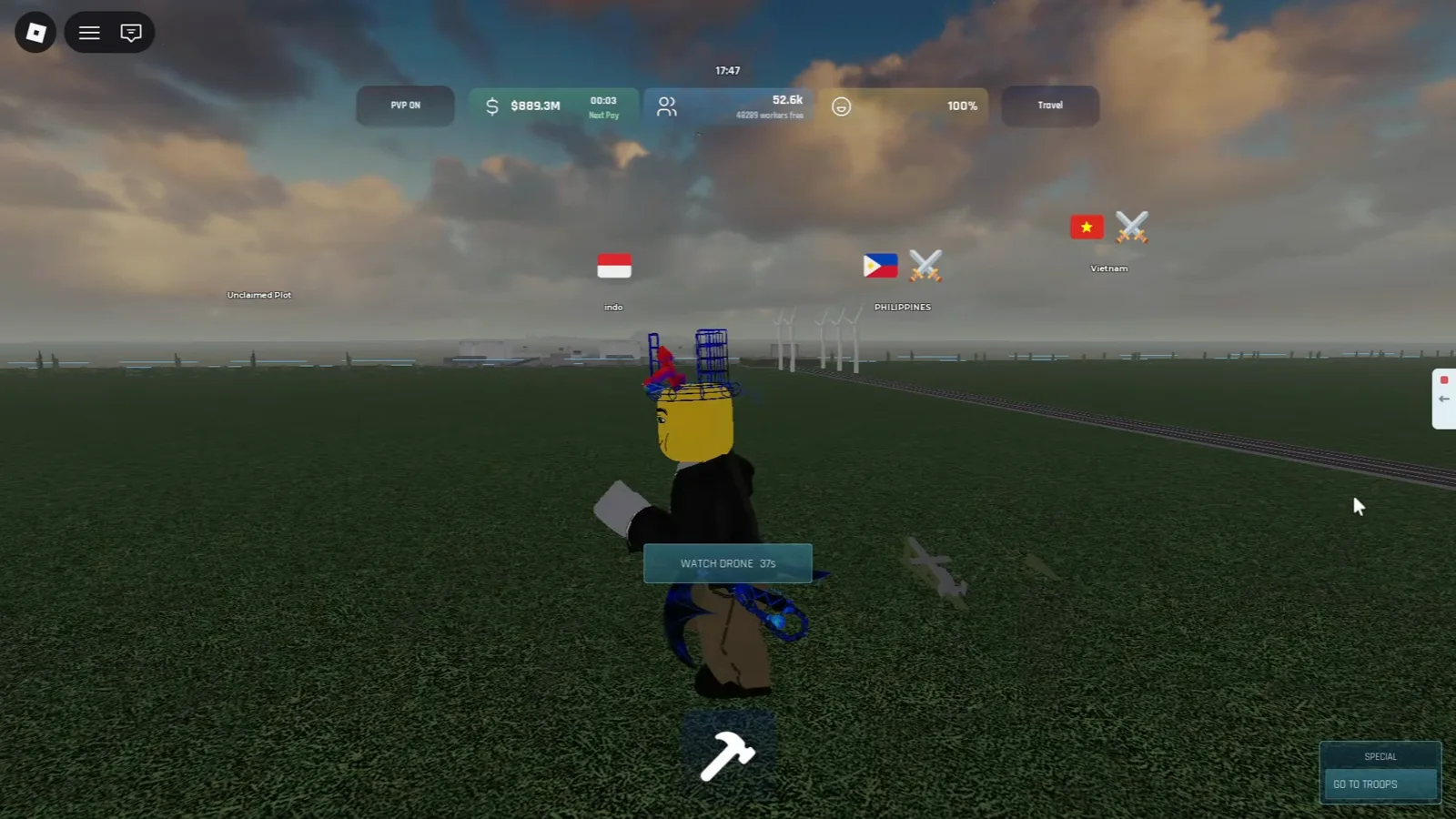 Build and Conquer Roblox WATCH DRONE countdown prompt floating above the player avatar during a drone flight test on grass